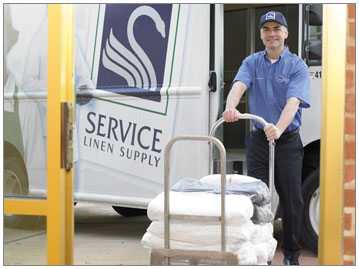 service-linen-driver-and-truck